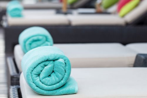 Fresh bath towels and pool towels prepared for hotel guests