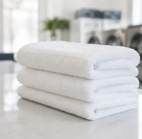 Fluffy clean white bath towels and hand towels for short-term rentals