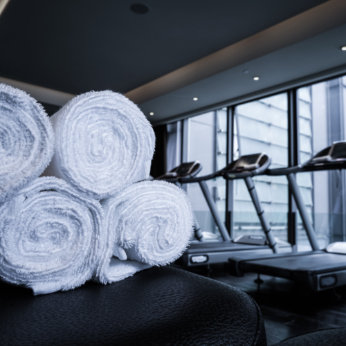 Gym towels and workout linens ready for commercial laundering